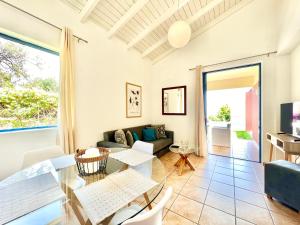 a living room with a couch and a table at Villa Barbati Pelagos with private pool by DadoVillas in Barbati