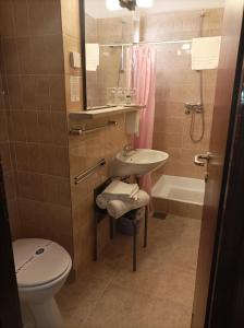 a bathroom with a sink and a toilet and a shower at Villas Arbia - Rio by the Beach in Rab