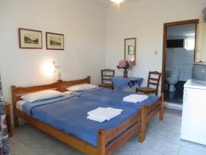 Postel nebo postele na pokoji v ubytování Panagiotis Apostoloudias Rooms