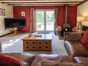 a living room with a couch and a coffee table at Ellerbeck Bridge in Kendal