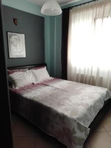 Postel nebo postele na pokoji v ubytování SOFI APARTMENT