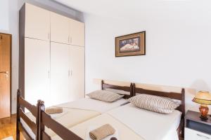 Posteľ alebo postele v izbe v ubytovaní Apartments Bongavila