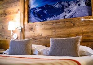 Voodi või voodid majutusasutuse Nendaz 4 Vallées & SPA 4* Superior toas