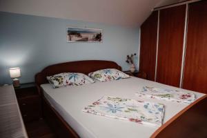a bedroom with a bed with two pillows on it at Holiday home in Dvor Kranjska Krain 42901 in Dvor