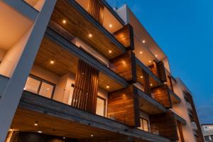 an exterior view of a building with wood at Premier 401 3 bedroom penthouse in Paphos City
