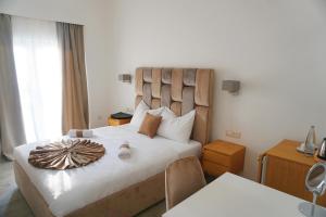 Letto o letti in una camera di Hotel Credo