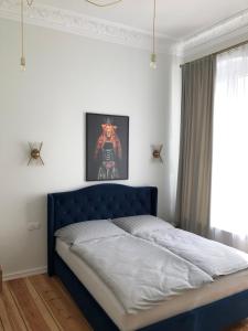 Llit o llits en una habitació de Apartament przy Studni Czarownic