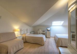 Postel nebo postele na pokoji v ubytování Hotel Giardino Suites&Spa
