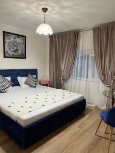 a bedroom with a large bed and a window at La Mosie in Corbu