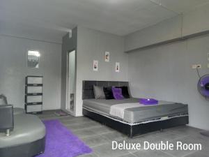Postel nebo postele na pokoji v ubytování RINA Guest House Pacitan