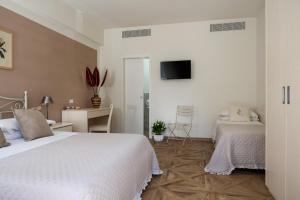 Postel nebo postele na pokoji v ubytování Hotel Giardino Suites&Spa
