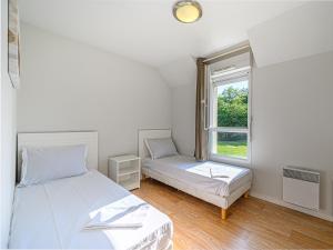 Postel nebo postele na pokoji v ubytování Vacancéole - Ker Goh Lenn - Vannes / Morbihan