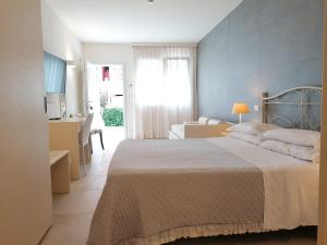 Postel nebo postele na pokoji v ubytování Hotel Giardino Suites&Spa