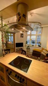 a kitchen with a stove top oven in a kitchen at Lovely apartment in the centre, street level and inner yard in Helsinki