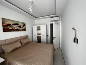 Postel nebo postele na pokoji v ubytování Cozy apartments near Cleopatra