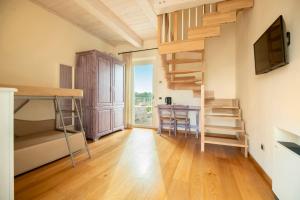 TV a/nebo společenská místnost v ubytování Hotel Giardino Suites&Spa