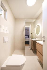 Ένα ή περισσότερα κρεβάτια σε δωμάτιο στο Apartments and rooms Mila M