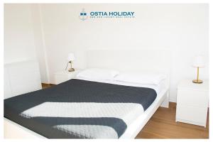 Łóżko lub łóżka w pokoju w obiekcie Appartamento Santa Barbara