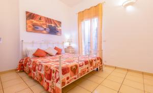 A bed or beds in a room at Luxury Apartments - Torre San Giovanni