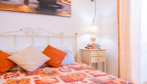 A bed or beds in a room at Luxury Apartments - Torre San Giovanni