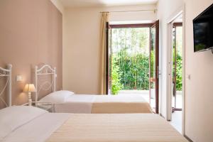 Postel nebo postele na pokoji v ubytování Hotel Giardino Suites&Spa