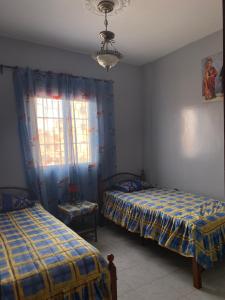 Säng eller sängar i ett rum på Dar Saada Imm. 5