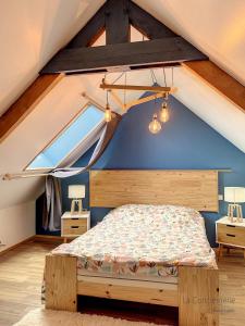 a bedroom with a bed in the attic at AS 50 - Les bateaux au bord de l'eau in Ault