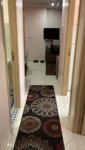 a hallway with a rug on the floor in a house at TRIO in Agadir