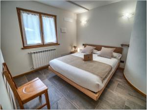Cama ou camas em um quarto em Foresteria Lombarda San Rocco