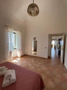 a bedroom with a bed with two towels on it at Farm seaview on Capri in Termini