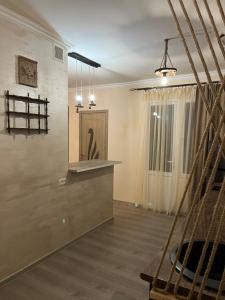 a tasting room with a counter and a window at Милый Дом in Vanadzor