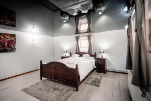 En eller flere senge i et værelse på Dadi House