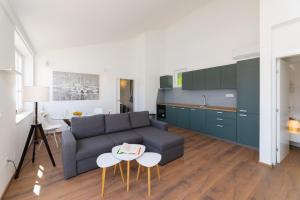 a living room with a couch and a table at Apartment ACI Marina MILNA Brač in Milna