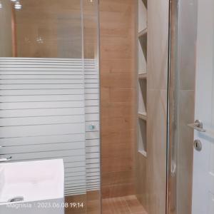 a shower with a glass door in a bathroom at Bay Villas Lefokastro in Lefokastro +31 photos