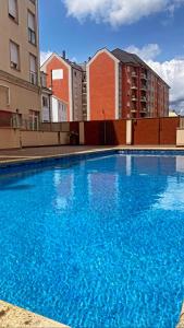 Bazén v ubytování DÚPLEX DE LUJO EN FOZ CON VISTAS al MAR nebo v jeho okolí