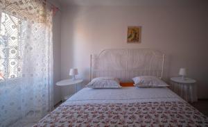 Postel nebo postele na pokoji v ubytování Manor house Aman