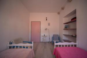 Postel nebo postele na pokoji v ubytování Manor house Aman