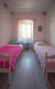 Postel nebo postele na pokoji v ubytování Manor house Aman