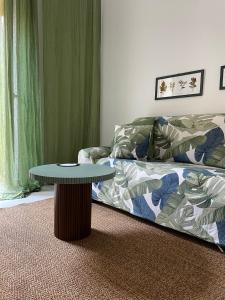 a living room with a couch and a table at la casa nel vicolo in Ascea