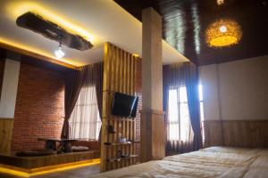 TV a/nebo společenská místnost v ubytování Pariban Hotel
