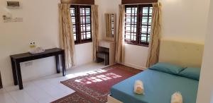 Posezení v ubytování D'Impiana Riverview Chalet # Lenggong