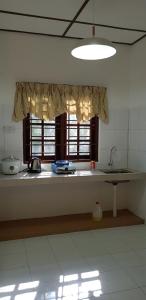 Kuchyň nebo kuchyňský kout v ubytování D'Impiana Riverview Chalet # Lenggong