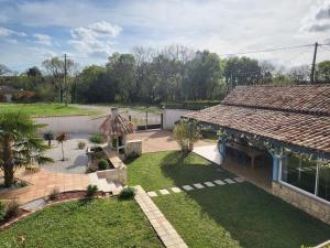 an overhead view of a house with a yard at Gite La Grange du Pech in Lacour