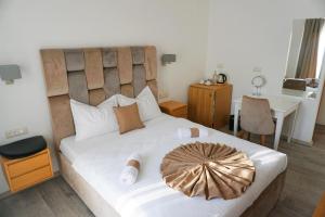 Letto o letti in una camera di Hotel Credo