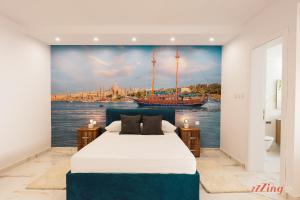 En eller flere senge i et værelse på CapriGem A luxury villa by the sea