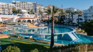 an image of a swimming pool at a resort at Grand Muthu Oura View Beach Club in Albufeira +47 photos