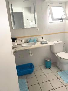 a bathroom with a sink and a toilet at Casa Monet - La Calma - 4 pools- Big terrace - Orihuela Costa in Playa Flamenca