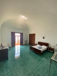 Ένα ή περισσότερα κρεβάτια σε δωμάτιο στο Casa di don Francesco