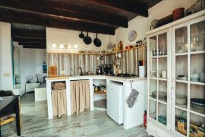 a large kitchen with wooden cabinets and a counter top at Finca Vino Tinto 1 in Icod de los Vinos