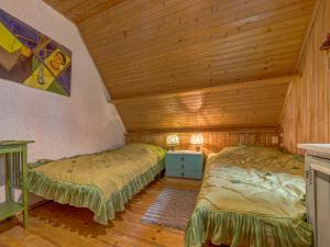 Łóżko lub łóżka w pokoju w obiekcie Holiday Home Hatale by Interhome